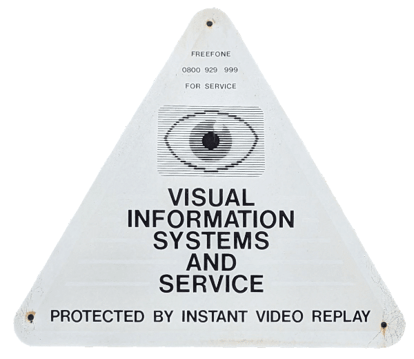 A triangular warning sign with a stylised eye, and the words 'Visual information systems and service - protected by instant video replay.
